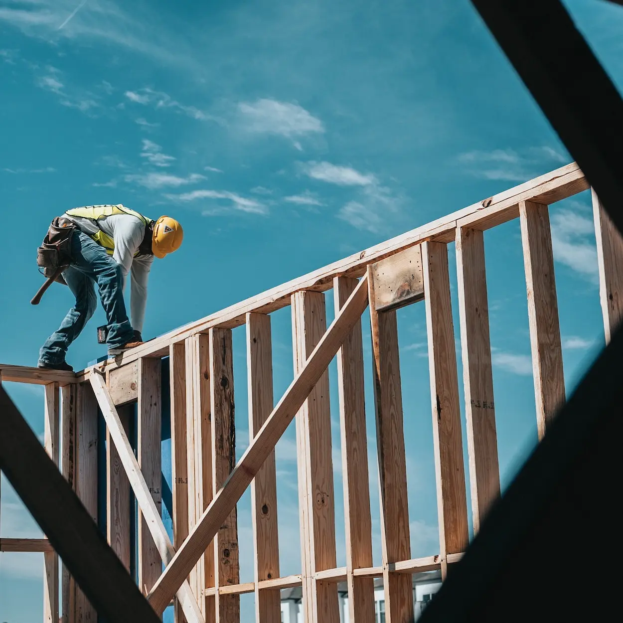 Worker working on top of a frame
