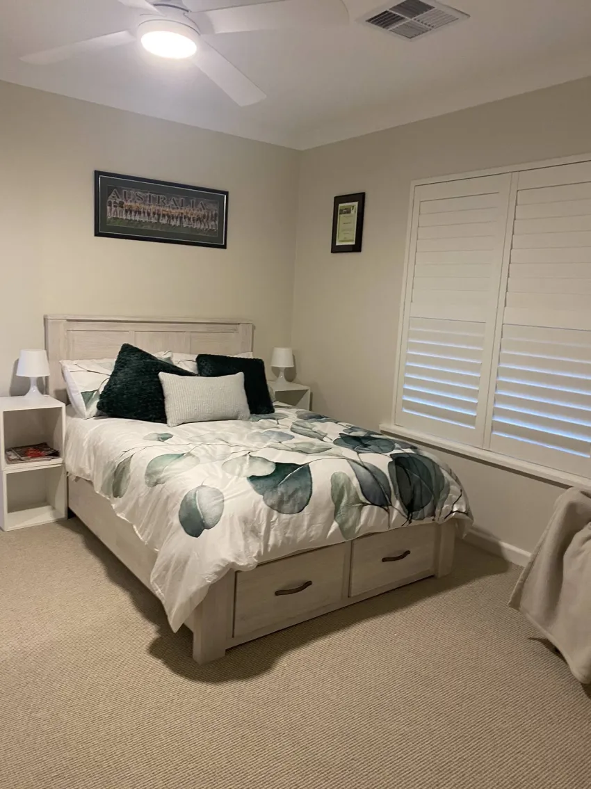 A renovated bedroom with a light cream colour.